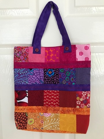 Roz made a bag from leftover squares from a quilt made from leftover fabrics!
